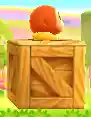 A Waddle Dee standing on a wooden crate, from Kirby: Triple Deluxe