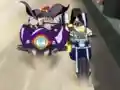 Fang and Gus wrestle with each-other on the racetrack.