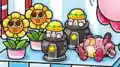 Two toys of Kirby in a cannon, from the book Find Kirby!! Full of Kirby