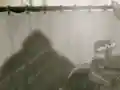 Escargoon is hammered by King Dedede while taking a shower, referencing the famous shower murder scene from Alfred Hitchcock's movie Psycho