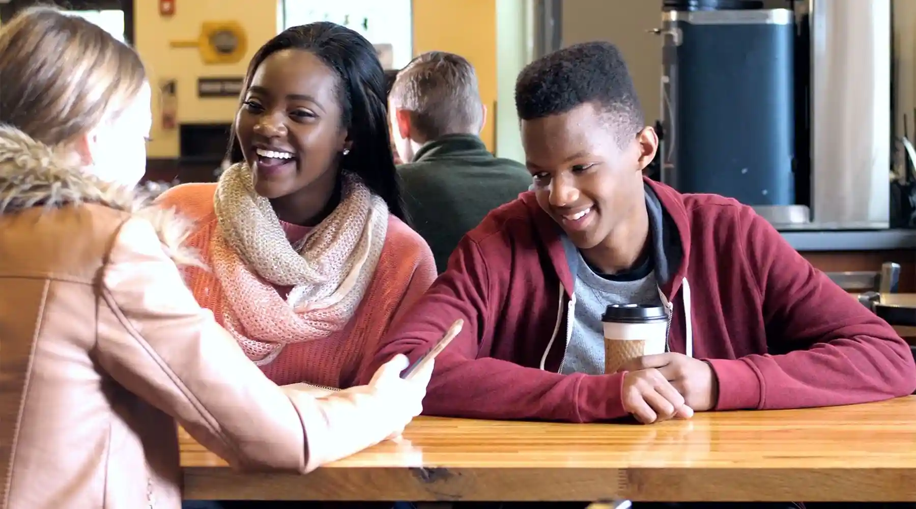 Image of teenagers looking at social media.