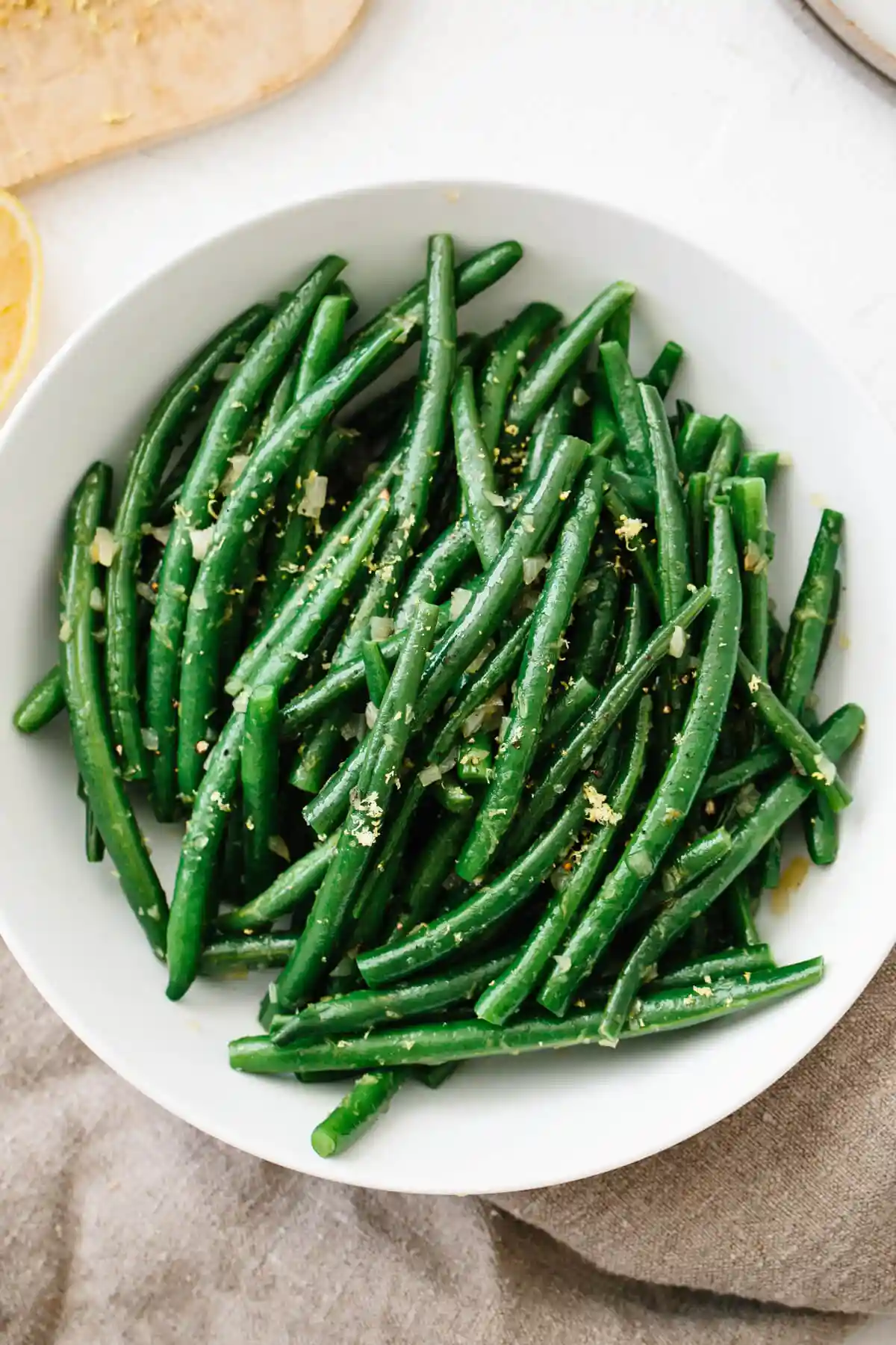 Green beans in a white bowl.