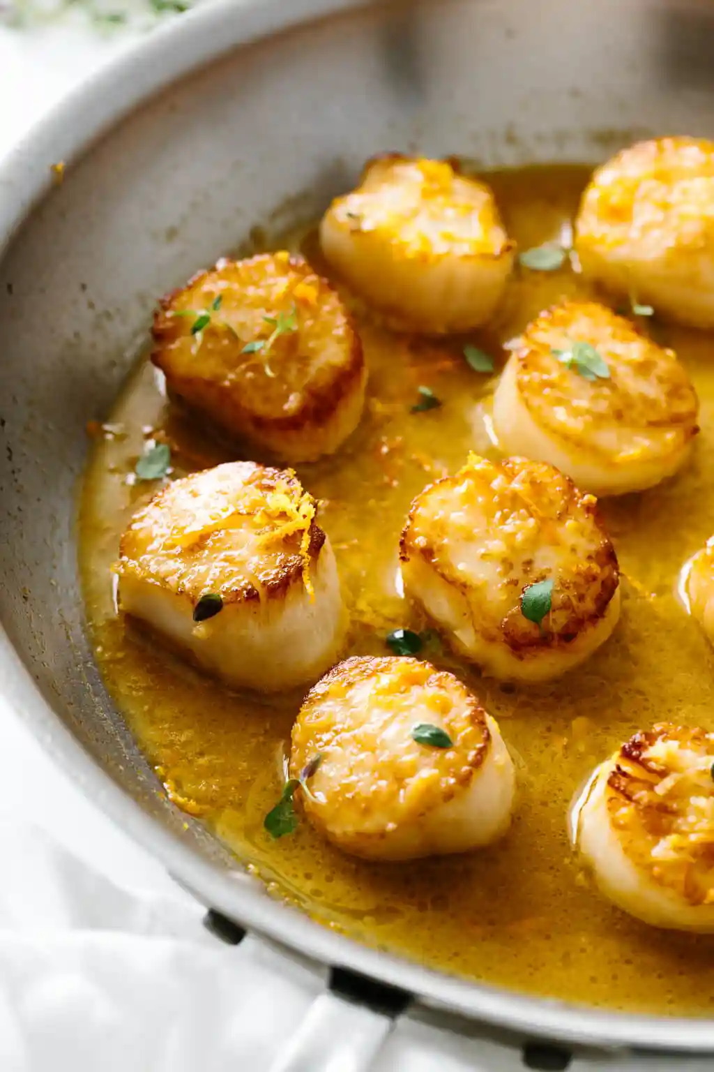 Scallops in a pan.