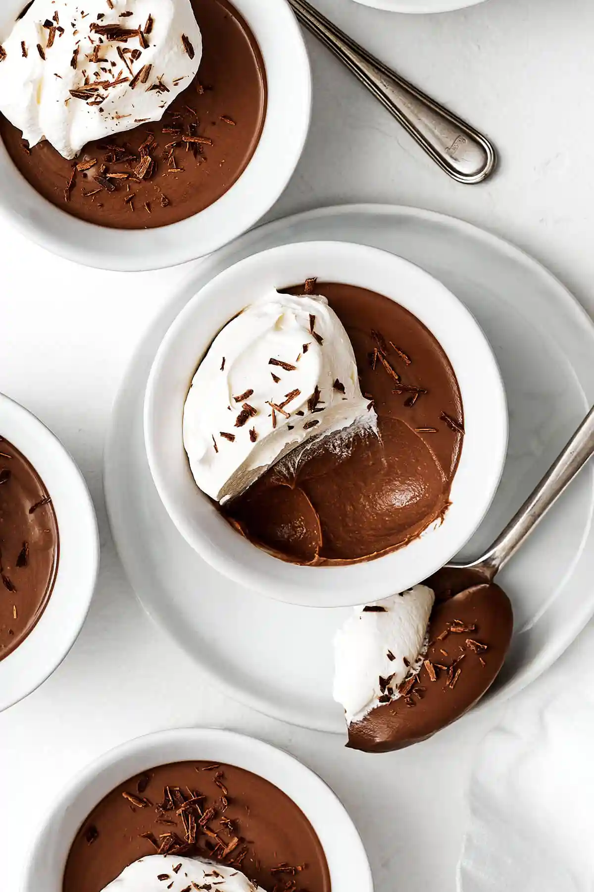 A half eaten chocolate pot de creme.