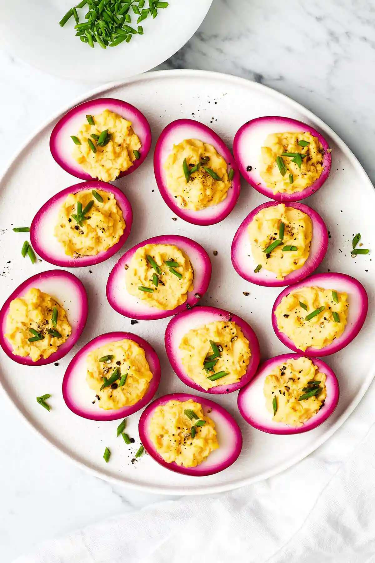A platter of beet pickled deviled eggs