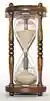 The flow of sand in an hourglass can be used to measure the passage of time. It also concretely represents the present as being between the past and the future.
