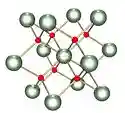 Ball and stick model of cubic-like crystal structure containing two types of atoms.