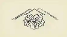 A publisher's seal in the shape of a flower within a stylized mountain