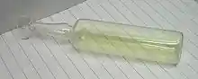 A glass container filled with chlorine gas