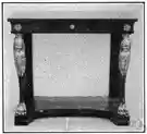 console - a small table fixed to a wall or designed to stand against a wall