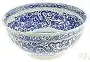 willow-pattern - chinaware decorated with a blue Chinese design on a white background depicting a willow tree and often a river