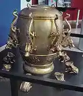 Picture of ornate urn-like device with spouts in the shape of dragons