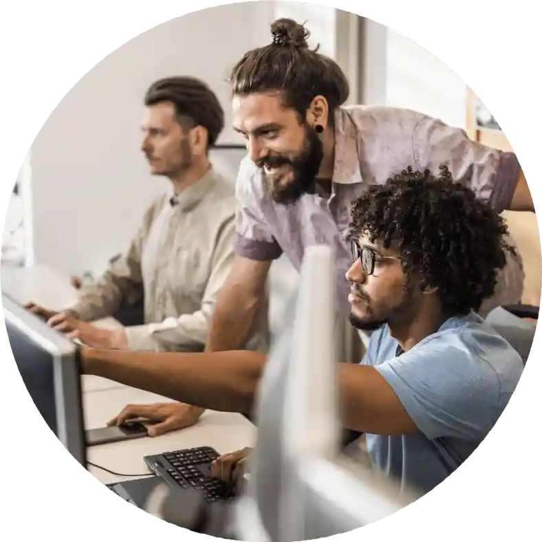 people working in front of monitors