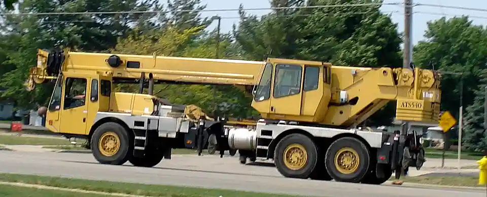 A truck-mounted crane in road travel configuration