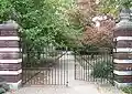 This gate and massive gateposts has no locks—a gate marks a borderline in ownership/use and can allow passage.