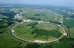 Bird's-eye view of a large circular shape inscribed into a grassy area