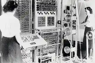 Two women are seen by the Colossus computer.