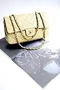 Chanel handbag in quilted-leather with adjustable double-chains to wear on the arm or shoulder.