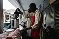 Butchers cutting chicken in Kenya