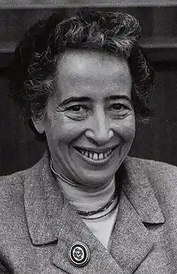 Black-and-white photo of a smiling woman with curly hair