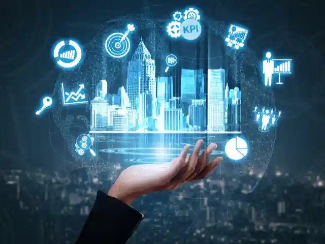 This is an image of a hand beneath digital icons for performance metrics and a metropolitan city.